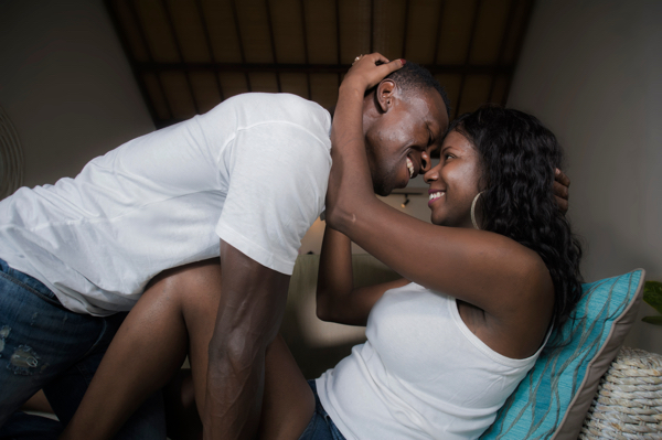 Abundant Health Centers sexual wellness a couple embracing on a sofa